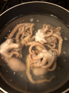 Octopus boiling in hot water